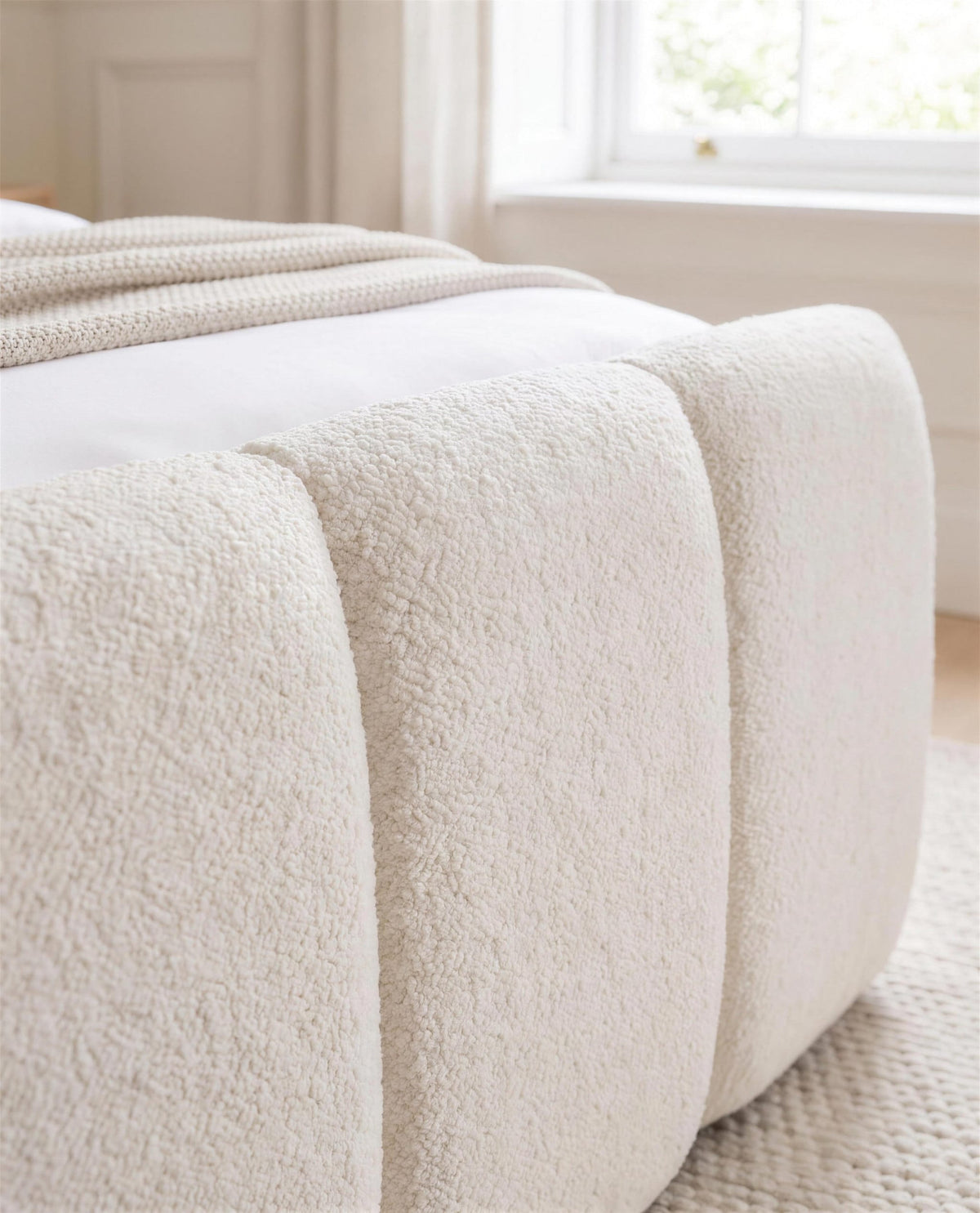 Cascade Paneled Luxury Bed, close-up of the upholstery detail